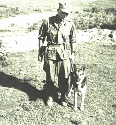 Black and White photo of Ron Aiello posing for a picture with Stomry in 1966.
